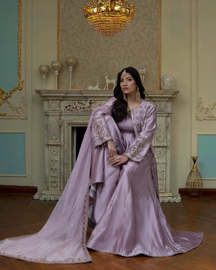 model wearing navya lilac fron open gown asian dress with heavy hand embroidery